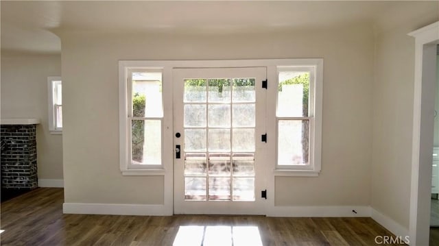 3688 Hoover St, Riverside, CA 92504 - doorway with wood finished floors, healthy amount of natural light, and baseboards