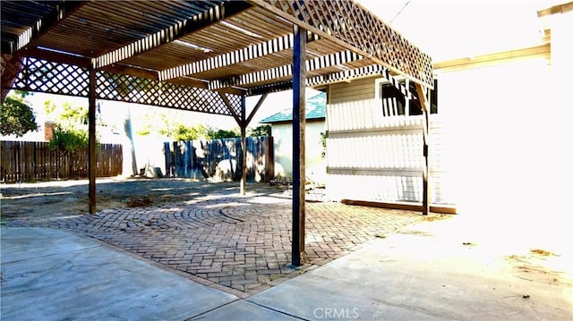 view of patio featuring fence and a pergola