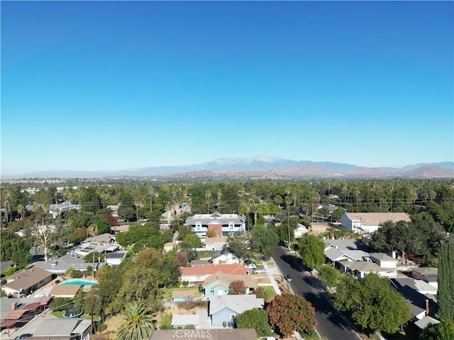 drone / aerial view featuring a residential view and a mountain view