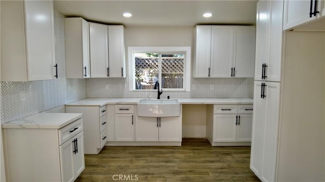 3688 Hoover St, Riverside, CA 92504 - kitchen with a sink, wood finished floors, tasteful backsplash, recessed lighting, and white cabinetry