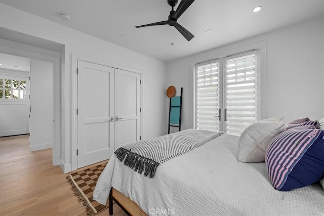 bedroom featuring baseboards, ceiling fan, light wood-style floors, a closet, and recessed lighting