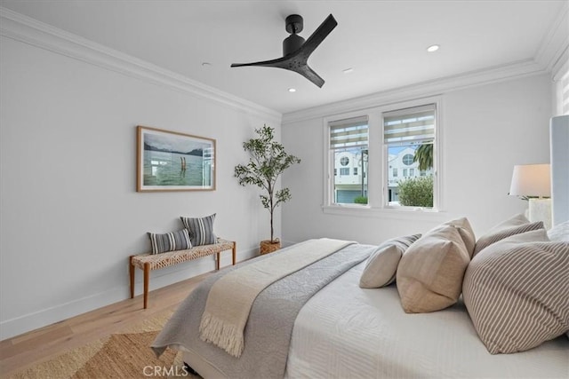 bedroom featuring ornamental molding, recessed lighting, baseboards, and wood finished floors