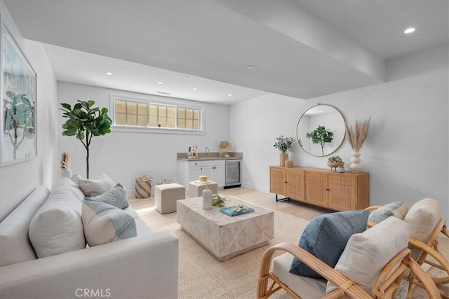 living area featuring light wood-style floors and recessed lighting