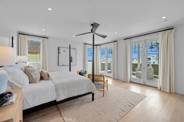 bedroom with recessed lighting, light wood-type flooring, a ceiling fan, and access to exterior