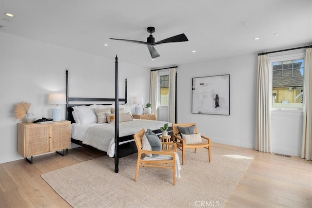 bedroom featuring light wood-type flooring, multiple windows, visible vents, and recessed lighting