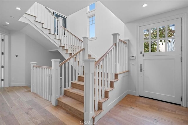 foyer featuring recessed lighting, baseboards, and light wood finished floors