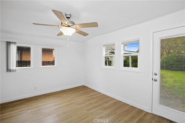 empty room with light wood-style flooring, baseboards, and ceiling fan