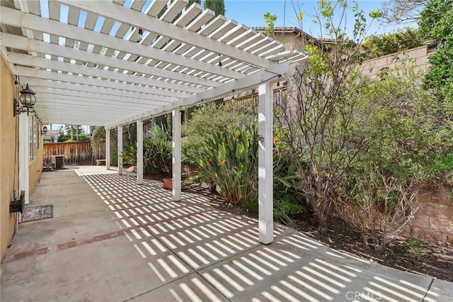 view of patio / terrace featuring a fenced backyard and central AC