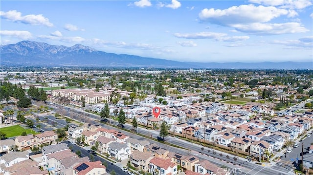 drone / aerial view with a residential view and a mountain view