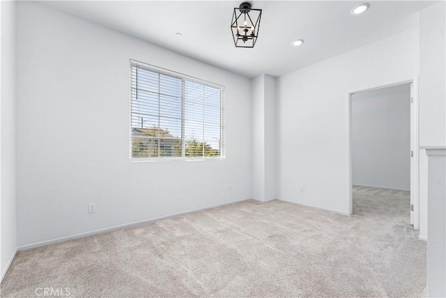 carpeted spare room with baseboards and recessed lighting