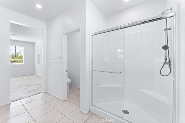 full bath featuring toilet, a stall shower, recessed lighting, and tile patterned floors