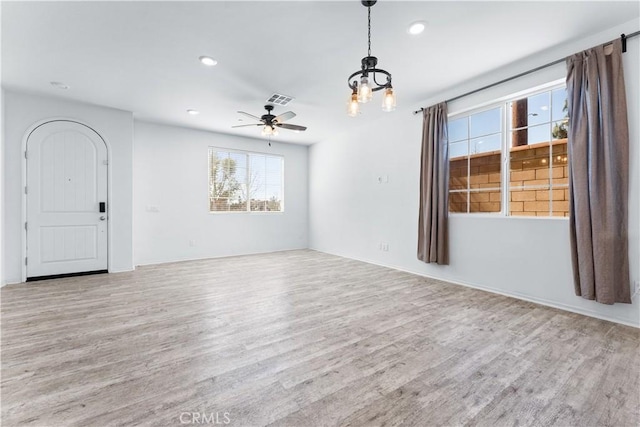 interior space with recessed lighting, visible vents, and wood finished floors