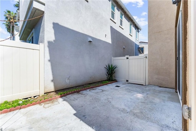 view of patio / terrace featuring a gate and fence