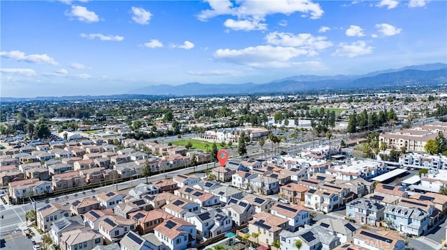 birds eye view of property with a residential view and a mountain view