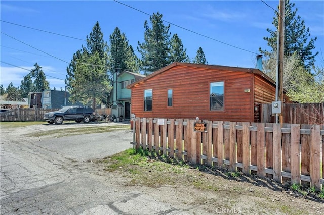 view of side of property with a fenced front yard