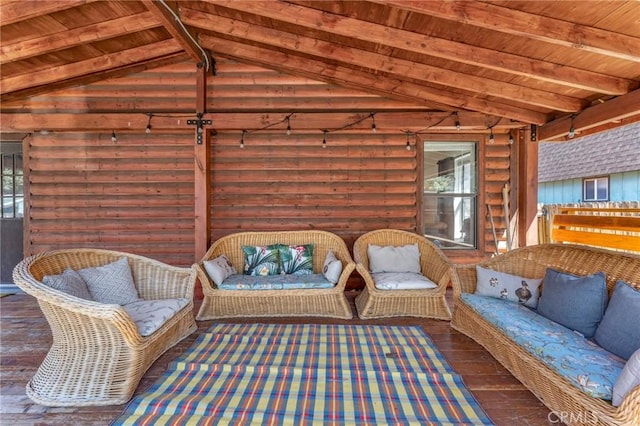 interior space featuring lofted ceiling with beams and wood ceiling