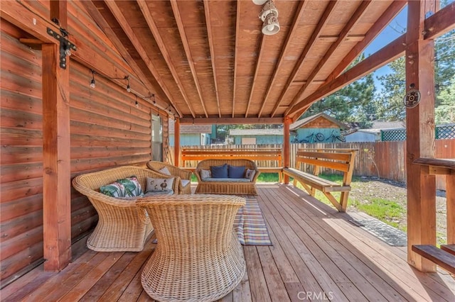 deck featuring fence and an outdoor living space