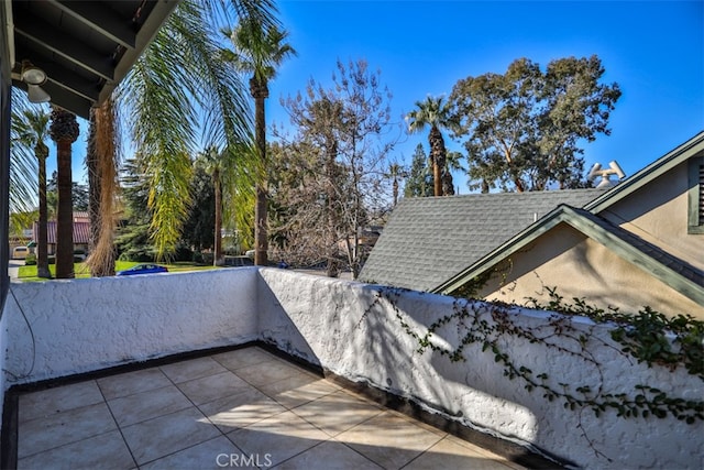 exterior space featuring a shingled roof