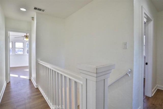 3255 N Arrowhead Ave, San Bernardino, CA 92405 - hallway featuring recessed lighting, an upstairs landing, dark wood-style flooring, baseboards, and visible vents