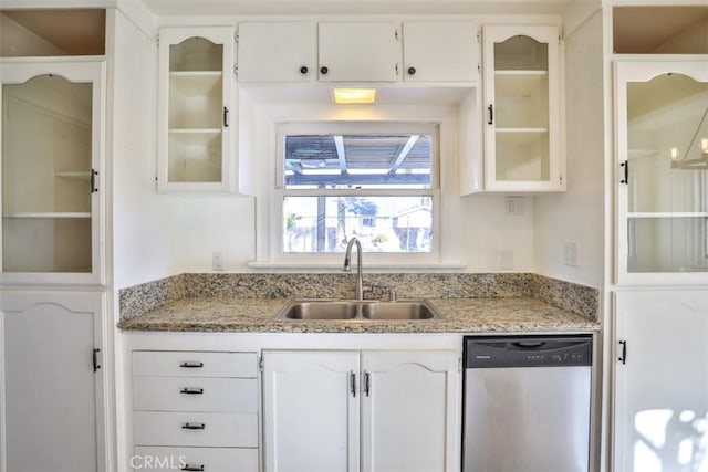 kitchen featuring a sink, glass insert cabinets, white cabinets, and stainless steel dishwasher