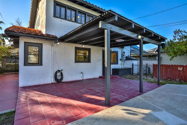 view of patio featuring fence