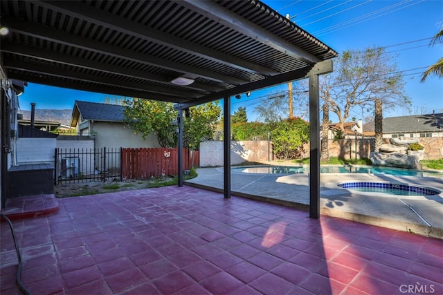 view of patio / terrace featuring a fenced in pool, a fenced backyard, and an in ground hot tub