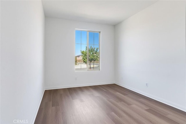 12945 Big Valley Ct, Riverside, CA 92503 - empty room featuring baseboards and wood finished floors