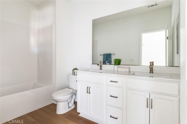 12945 Big Valley Ct, Riverside, CA 92503 - full bath featuring double vanity, a sink, toilet, and wood finished floors