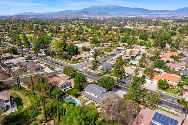 drone / aerial view featuring a residential view and a mountain view