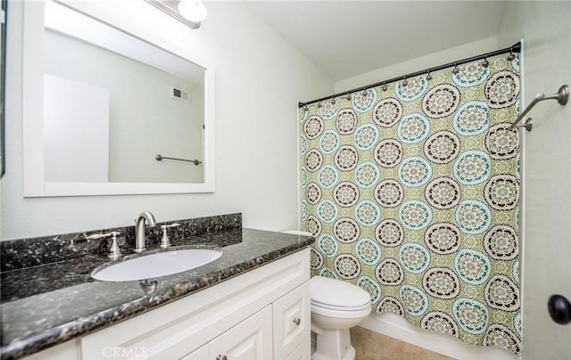 bathroom featuring visible vents, vanity, and toilet