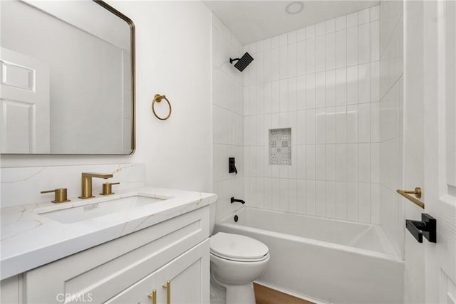 full bathroom featuring  shower combination, vanity, and toilet