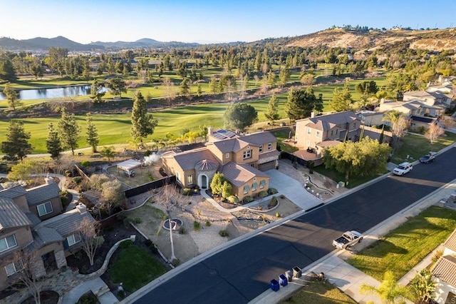 birds eye view of property featuring a residential view and a water and mountain view