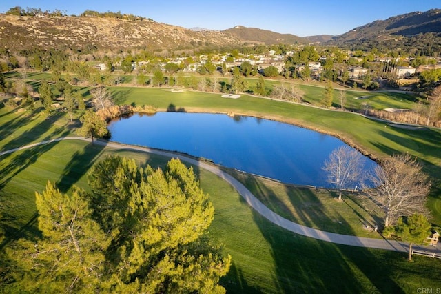 birds eye view of property featuring golf course view and a water and mountain view