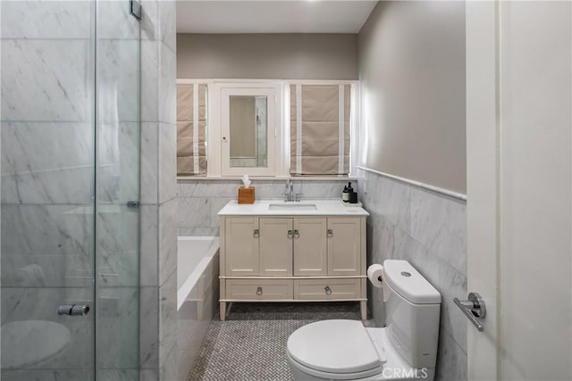 full bath with a garden tub, tile walls, toilet, an enclosed shower, and vanity