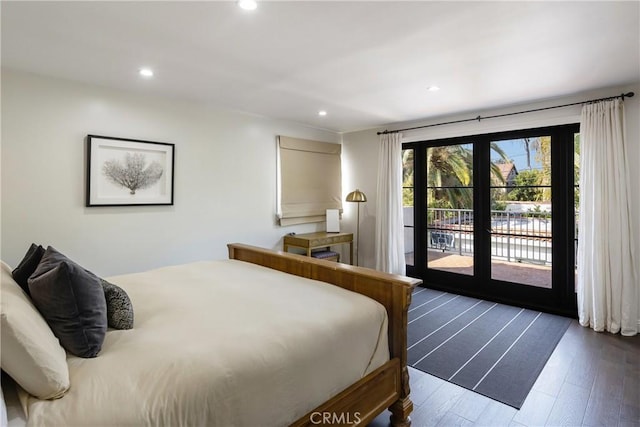 bedroom featuring access to exterior, recessed lighting, and dark wood finished floors