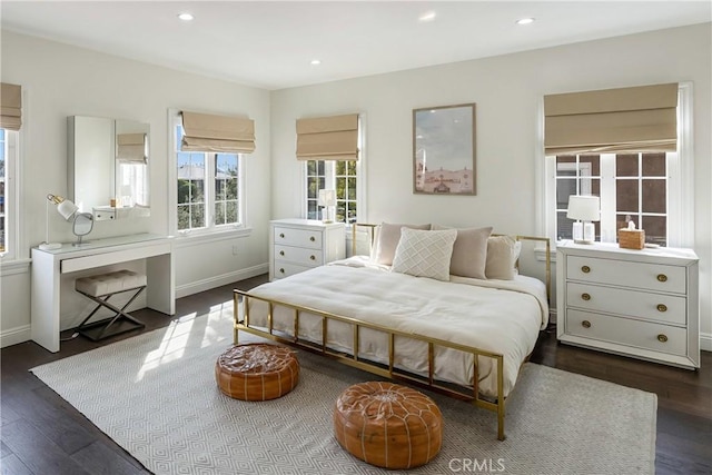 bedroom with recessed lighting, baseboards, and wood finished floors