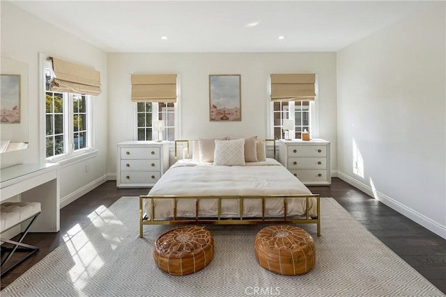 bedroom featuring recessed lighting, dark wood finished floors, and baseboards