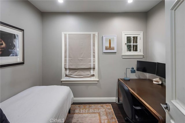 bedroom featuring dark wood-type flooring, recessed lighting, and baseboards