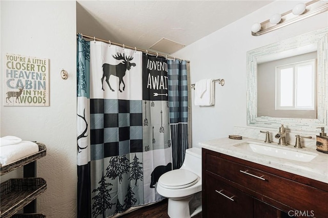 full bathroom with a shower with shower curtain, vanity, and toilet