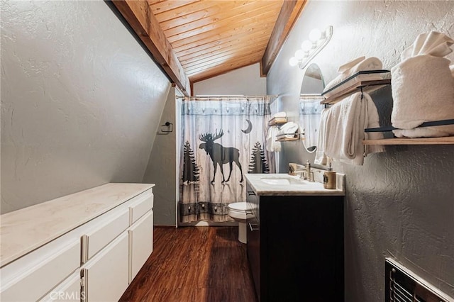 bathroom with a shower with shower curtain, toilet, wood finished floors, vaulted ceiling with beams, and vanity