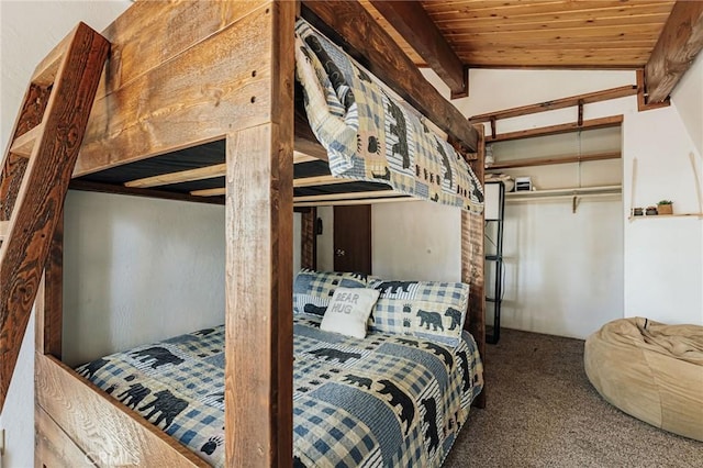 carpeted bedroom featuring lofted ceiling and wooden ceiling