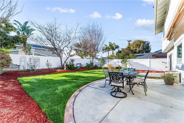 view of patio with outdoor dining area and a fenced backyard