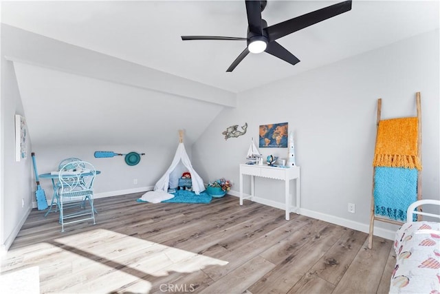 game room featuring lofted ceiling with beams, a ceiling fan, baseboards, and wood finished floors