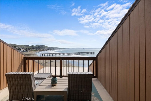 wooden deck with a water view