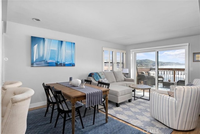 living room featuring wood finished floors and baseboards