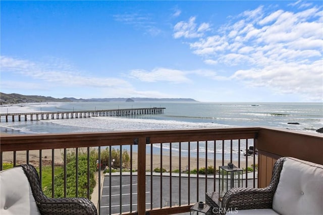 balcony featuring a water view