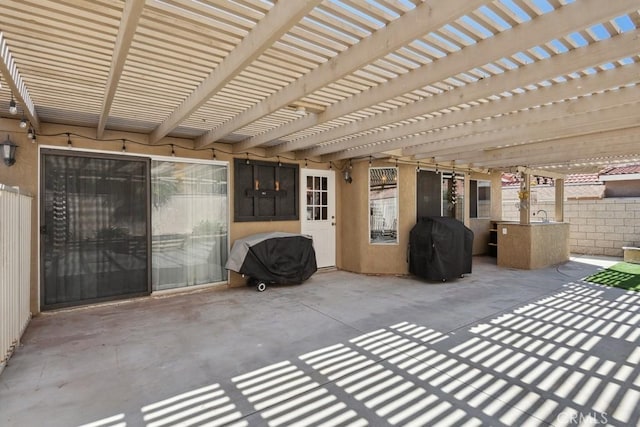 view of patio / terrace with fence and area for grilling