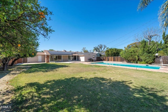 view of yard with a patio area, a fenced backyard, and a fenced in pool