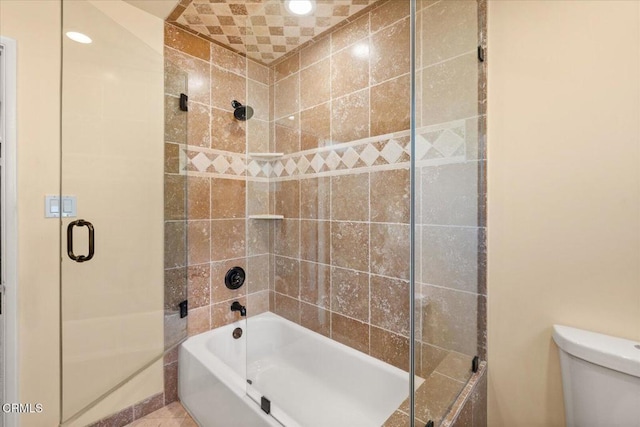 bathroom featuring toilet, shower / bath combination with glass door, and recessed lighting