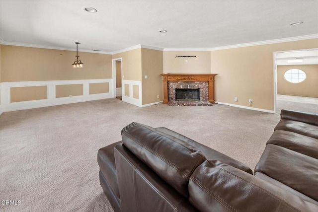 living area with crown molding, carpet flooring, a fireplace, and baseboards